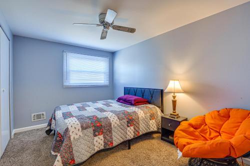 a bedroom with a bed and a ceiling fan at Maryland Abode with Patio Near Baltimore Harbor in Baltimore