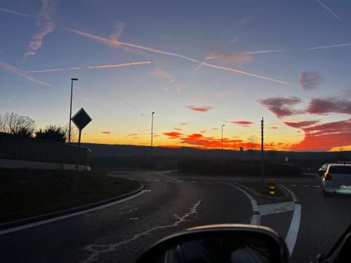 a car driving down a road at sunset at Marilyn in Niederwil