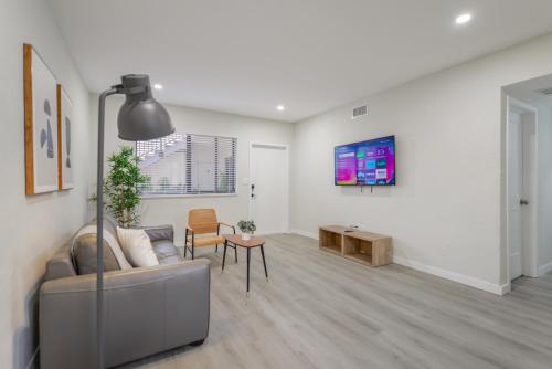 a living room with a couch and a table at Amazing Experience in Calle Ocho in Miami