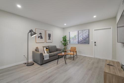 a living room with a couch and a table at Amazing Experience in Calle Ocho in Miami