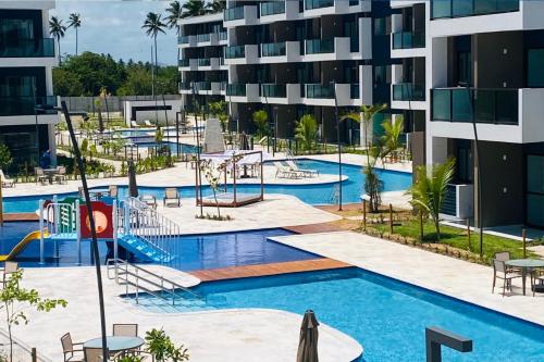 an image of a swimming pool at a apartment complex at Studio de Luxo em Muro Alto - Makia Beach A209 in Porto De Galinhas