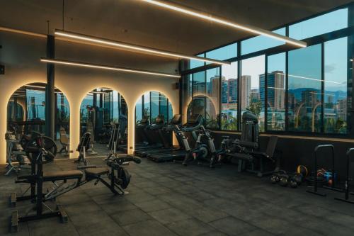 a gym with a view of the city at Kiin Living - Adults Only in Medellín