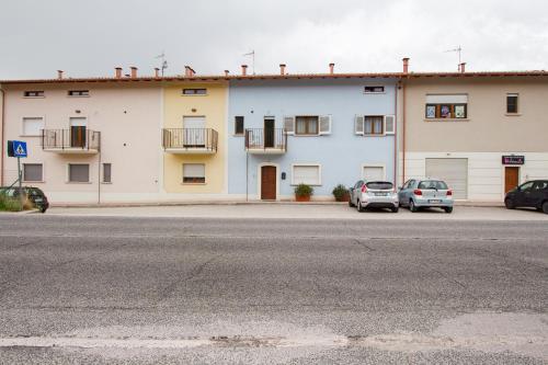 two cars parked in front of a building at Wolf House BnB in Coppito
