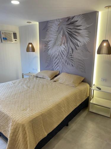 a bedroom with a large bed with two pillows at Florencia in Termas de Río Hondo