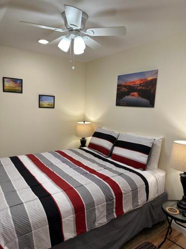a bedroom with a bed and a ceiling fan at NEW Private House B with Carports EV Plugin L2 in Twin Falls