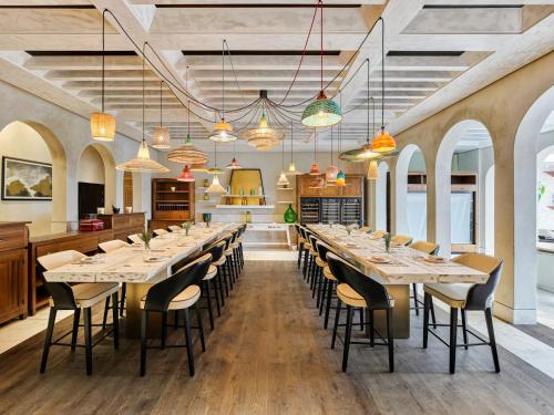 a large dining room with long tables and chairs at Fairmont Tazi Palace Tangier in Tangier