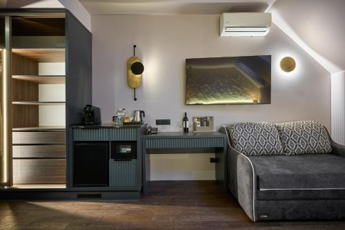 a living room with a desk and a couch at F&B Spa Resort (ex. Fomich Hotel) in Bukovel