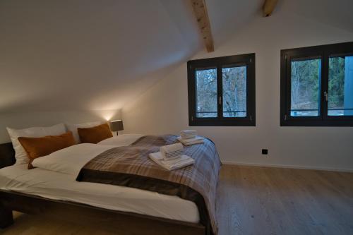 Ein Bett oder Betten in einem Zimmer der Unterkunft Eiger View Alpine Lodge
