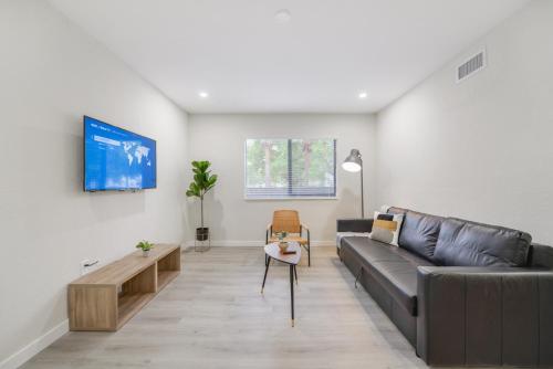 a living room with a couch and a table at Apartment in Calle Ocho a Slice of Little Havana in Miami