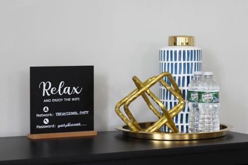 a table with a bottle of water and a box of water at The National Hotel in Frenchtown