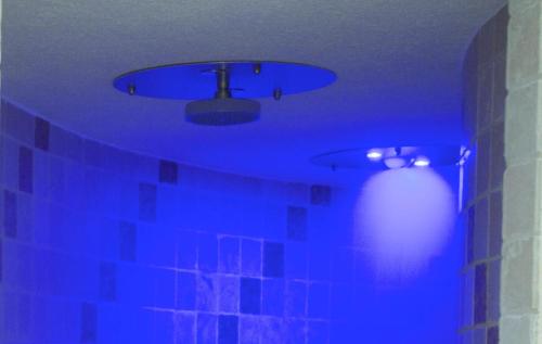 a blue room with a ceiling with a blue light at Sporting Hotel in Passo del Tonale