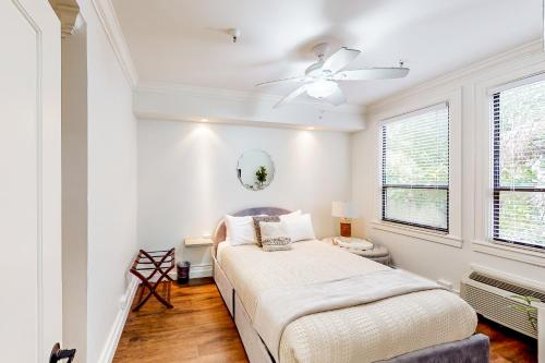 a bedroom with a bed and a ceiling fan at Sunrise Suite #2232 in Palm Beach