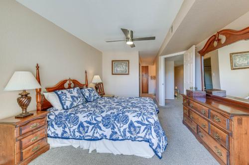 a bedroom with a blue and white bed and a dresser at Mesa Condo Rental with Community Pool Access! in Mesa