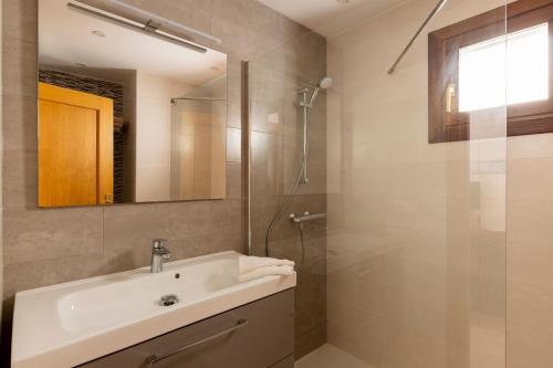 a bathroom with a sink and a shower at Marina Dor III -Villa #10 Studio in Santanyi