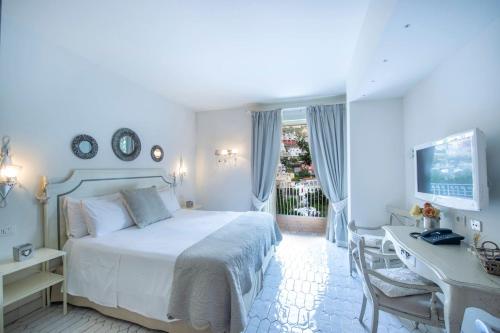 Ένα ή περισσότερα κρεβάτια σε δωμάτιο στο My Exclusive Italy - Villa in Positano with luxury spa & amazing view