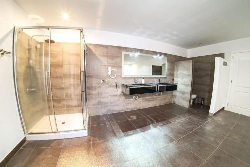 a bathroom with a shower and a sink at Villa Mirador de los Abrigos in La Mareta