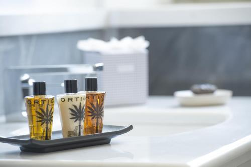 two bottles sitting on top of a counter at My Exclusive Italy - Villa Chianti with panoramic pool on the vineyard in Greve in Chianti