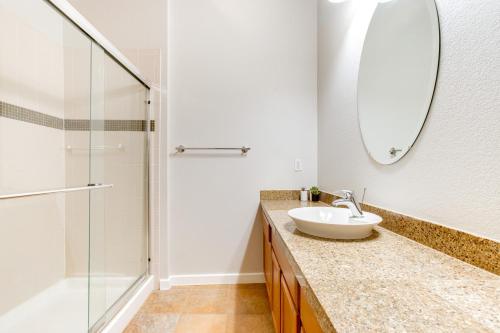 a bathroom with a sink and a shower at LoHi Condo with Balcony 1 Mi to Downtown Denver! in Denver