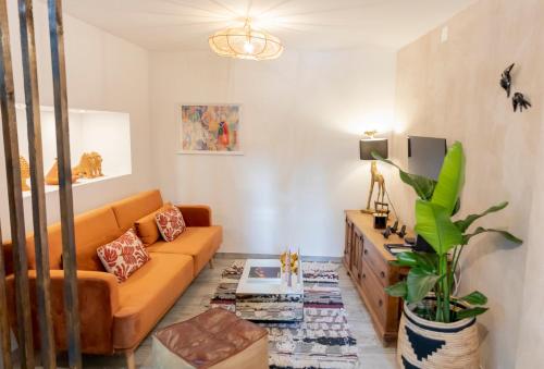 a living room with a couch and a table at Portas da Cidade Home in Silves