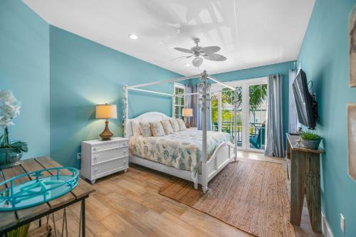 a bedroom with a bed and a ceiling fan at Southern Exposure AMV in Anna Maria