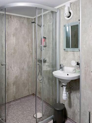 a bathroom with a shower and a sink at Stavanger BnB 4 by Sidd in Stavanger