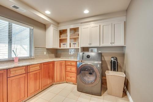 a kitchen with a washing machine in a kitchen at Expansive Mountain Gem Game Room, 3 Mi to Acton in Ravenna