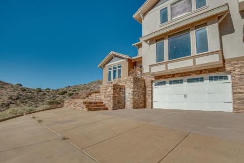 a large house with a white garage door at Expansive Mountain Gem Game Room, 3 Mi to Acton in Ravenna