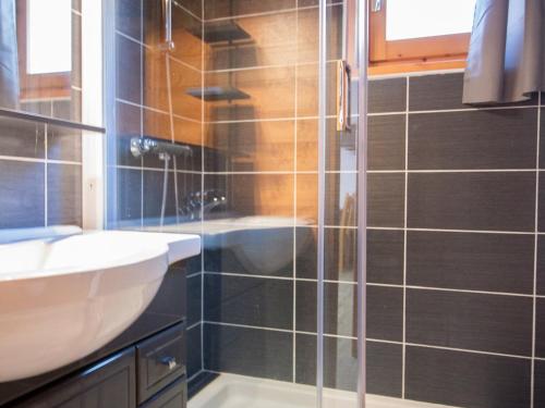 a bathroom with a shower with a sink and a tub at Appartement Aussois, 2 pièces, 4 personnes - FR-1-508-37 in Aussois