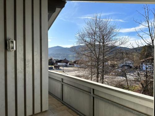 a balcony with a view of the mountains at muchhome LUXURY APARTMENTS - Apartment Vintage mit Balkon und Seeblick in Gmund am Tegernsee