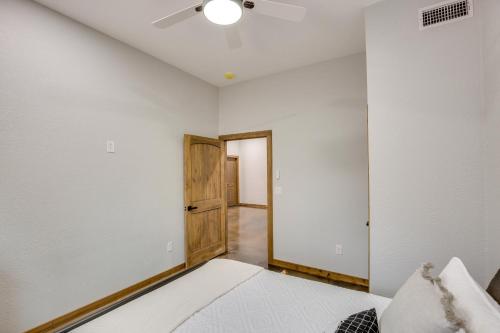 a bedroom with white walls and a ceiling at Peaceful Yantis Retreat - 1 Mi to Lake Fork! in Yantis