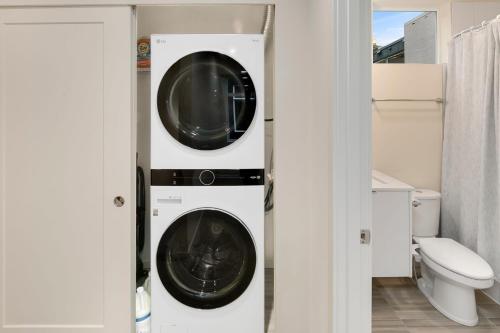 a bathroom with a washer and dryer at Metro Malden BY Betterstay in Seattle