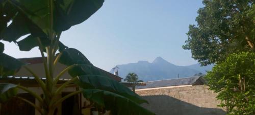 a view of a house with mountains in the background at Casa Pico Bonito 