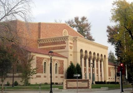 a large brick building with a red roof at IreneHouse Victorian INN in Sacramento