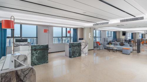 a large lobby with a view of the city at Holiday Inn Express Changsha Development Zone by IHG in Xingsha