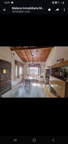 a room with a table and a dining room at 9 amigos in Villa Gesell