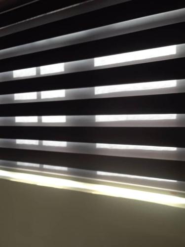 a close up of the blinds of a window at Berkley House in Lagos