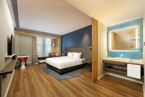 Ένα ή περισσότερα κρεβάτια σε δωμάτιο στο Holiday Inn Express Haiyan by IHG