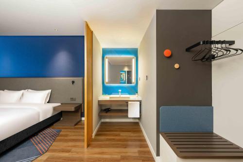 Ένα ή περισσότερα κρεβάτια σε δωμάτιο στο Holiday Inn Express Haiyan by IHG