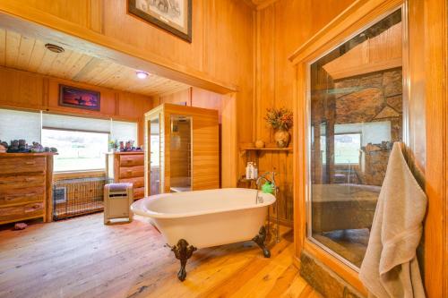 a large bathroom with a tub and a shower at Salmon Vacation Rental with Mountain Views! in Salmon