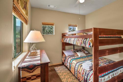 a bedroom with a bunk bed and a desk at Great Sedona Home Sensational Views! in Sedona