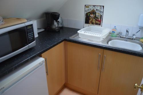 Кухня или кухненски бокс в Holiday Apartment Dunfermline
