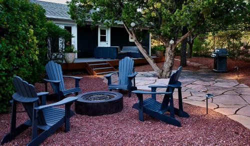 a group of chairs sitting around a fire pit at The Dahl House Of Sedona in Sedona
