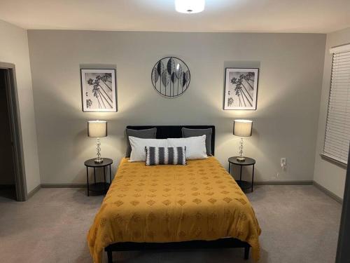 a bedroom with a bed with two lamps on it at Modern Luxury Fully Furnished 2BRM & 2Bath Downtown Atlanta Apartment in Atlanta