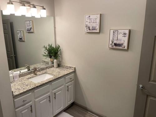 a bathroom with a sink and a mirror at Downtown Atlanta in Atlanta