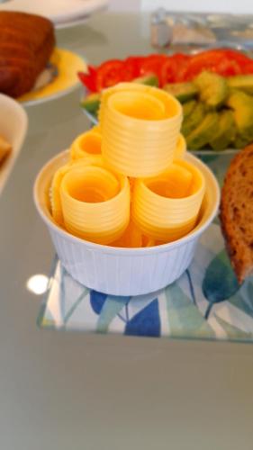 a white bowl filled with pasta on a table at Seascape Villa B&B in Tauranga