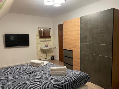 Postel nebo postele na pokoji v ubytování FeWo An der Hoppecke zwischen Brilon und Willingen