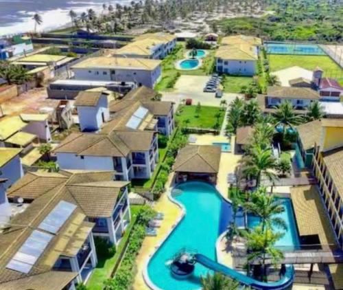 arial view of a resort with a water park at Casa pé na areia no Tree Bies in Subaúma