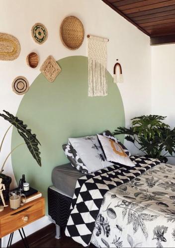 a bedroom with a bed and a desk at Art riad au bord de la mer 2 in El Jadida