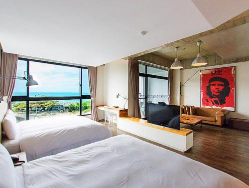 Postel nebo postele na pokoji v ubytování El Puerto Hotel