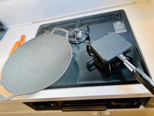 a laptop computer with a microphone in it at Eldor Nishikoujiya Apartment by Tranova in Tokyo
